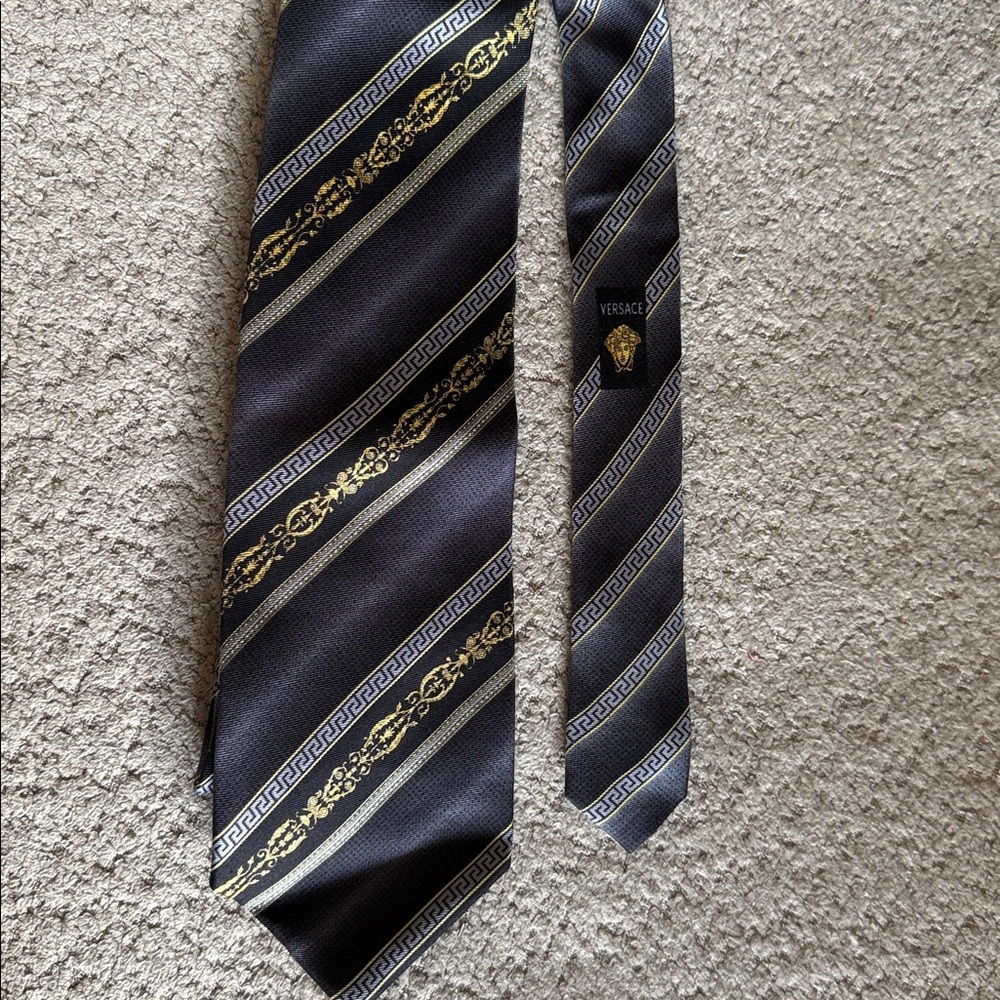 Versace Elegant Black and Gold Striped Tie